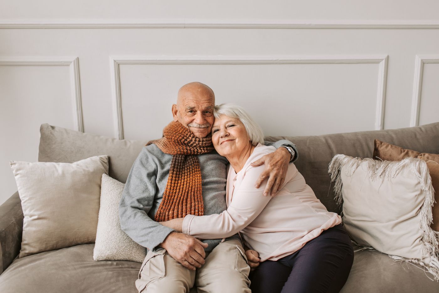 Happy older couple relaxing together at home